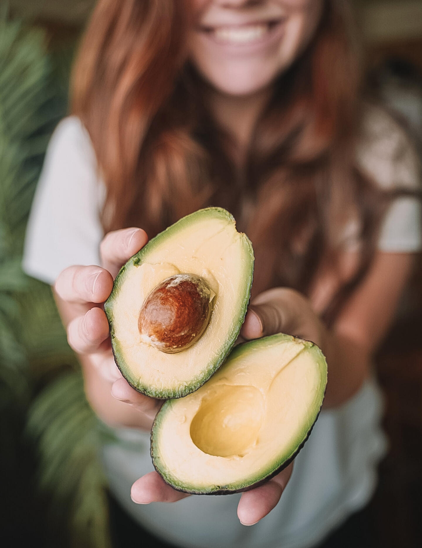 Girl presenting a Hass Avocado